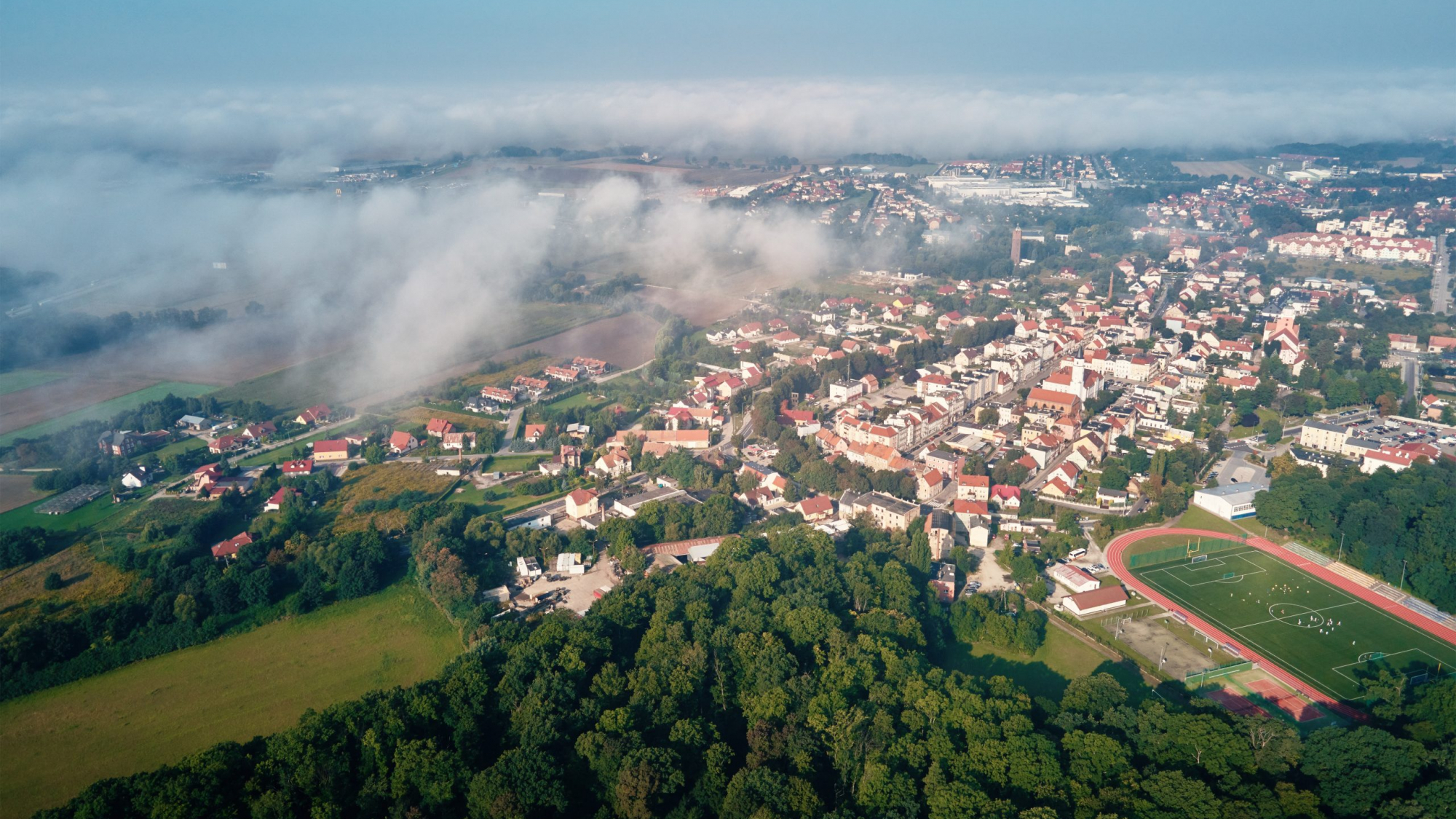 Aerial view of european city with architecture buildings and streets. Central square of small town cityscape, top view