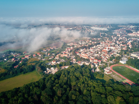 Aerial view of european city with architecture buildings and streets. Central square of small town cityscape, top view