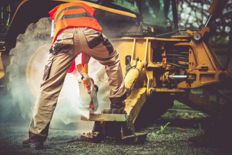 Ambitious Construction Worker Cutting Concrete Elements Using Stone Cutter.